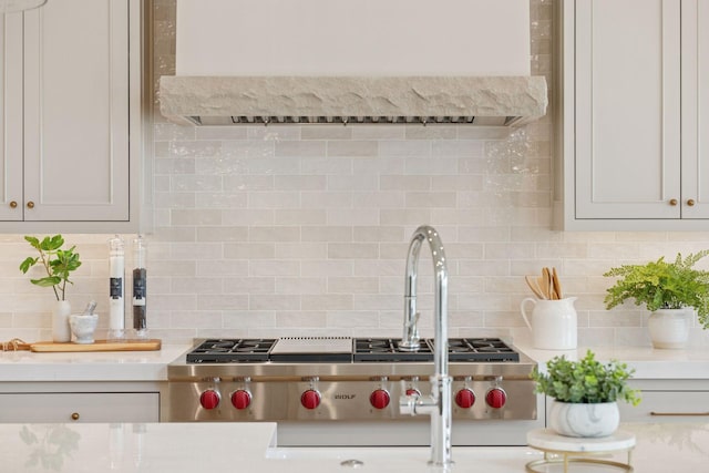 6176 Broadview Ave, Credit River Twp, MN 55372 - kitchen with range hood and tasteful backsplash