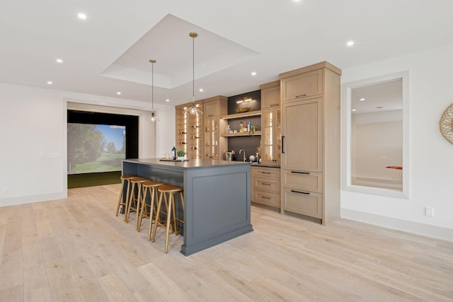 6176 Broadview Ave, Credit River Twp, MN 55372 - indoor wet bar featuring light wood-type flooring, recessed lighting, decorative light fixtures, and a raised ceiling