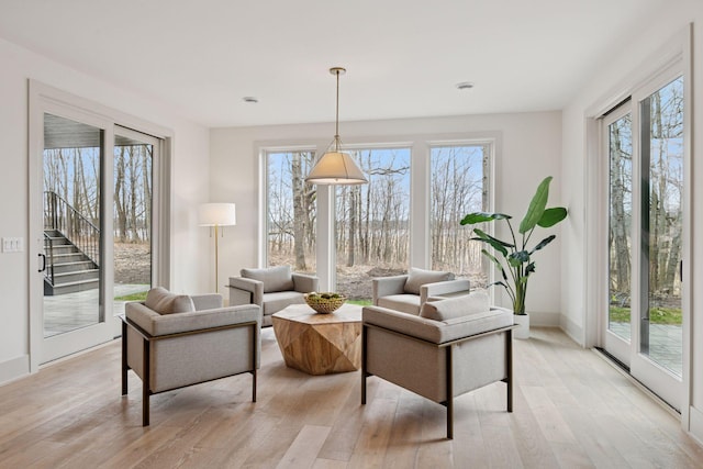6176 Broadview Ave, Credit River Twp, MN 55372 - living area with plenty of natural light, light wood finished floors, and stairway