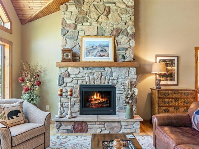 13598 Ox Cove Trl, Crosslake, MN 56442 - living room with wooden ceiling, vaulted ceiling, wood finished floors, and a stone fireplace