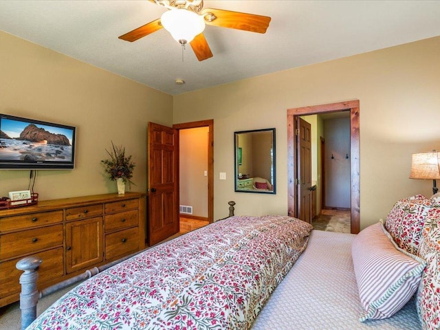 13598 Ox Cove Trl, Crosslake, MN 56442 - bedroom with light colored carpet and ceiling fan