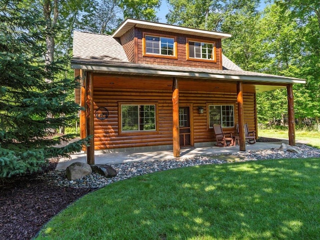 13598 Ox Cove Trl, Crosslake, MN 56442 - view of front of property with roof with shingles, a front lawn, and a patio