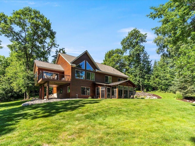 13598 Ox Cove Trl, Crosslake, MN 56442 - rear view of house featuring a yard, a sunroom, and a wooden deck