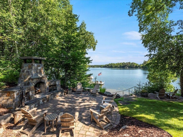 13598 Ox Cove Trl, Crosslake, MN 56442 - view of patio featuring a water view and an outdoor stone fireplace