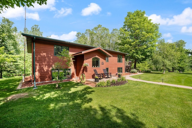 589 Seboe Rd, Wrenshall Twp, MN 55797 - view of front facade featuring a patio area and a front lawn