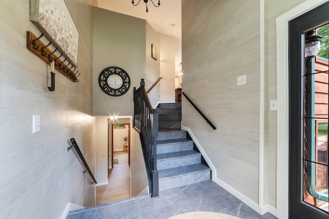589 Seboe Rd, Wrenshall Twp, MN 55797 - stairway featuring tile walls and a high ceiling