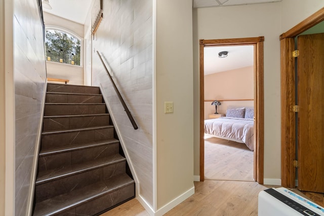 589 Seboe Rd, Wrenshall Twp, MN 55797 - stairway featuring wood finished floors and baseboards