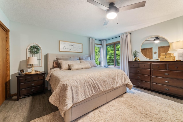 589 Seboe Rd, Wrenshall Twp, MN 55797 - bedroom featuring wood finished floors, a ceiling fan, and a textured ceiling