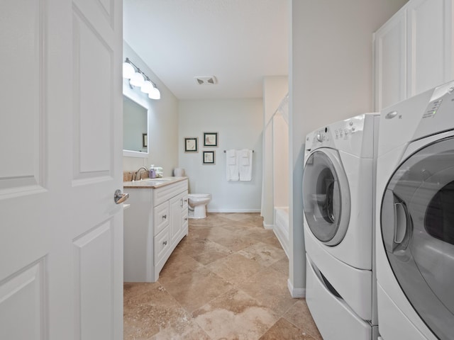 27842 Prairie Rose Rd, Elbow Lake, MN 56531 - laundry room with washer and dryer and light stone finish floors