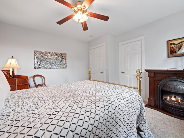 27842 Prairie Rose Rd, Elbow Lake, MN 56531 - carpeted bedroom featuring a brick fireplace and a ceiling fan