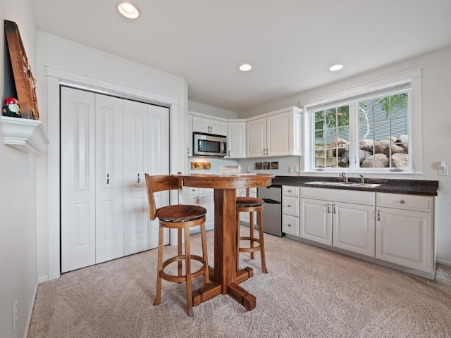 27842 Prairie Rose Rd, Elbow Lake, MN 56531 - kitchen with appliances with stainless steel finishes, dark countertops, light carpet, white cabinetry, and recessed lighting