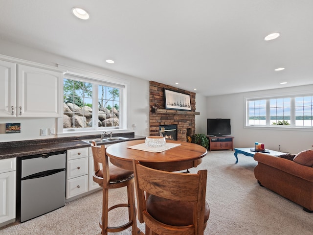 27842 Prairie Rose Rd, Elbow Lake, MN 56531 - living room with a stone fireplace, light colored carpet, and recessed lighting
