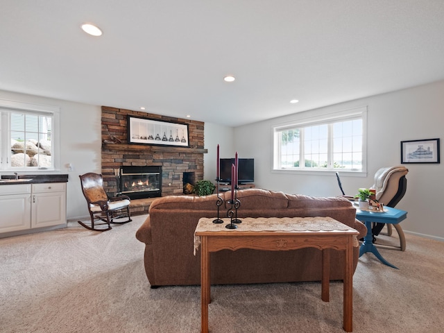 27842 Prairie Rose Rd, Elbow Lake, MN 56531 - living area featuring a stone fireplace, light carpet, and recessed lighting