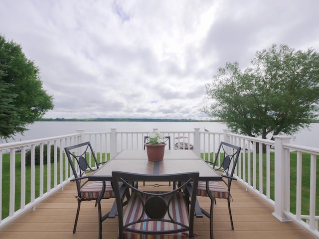 27842 Prairie Rose Rd, Elbow Lake, MN 56531 - wooden deck with a water view, outdoor dining area, and a lawn
