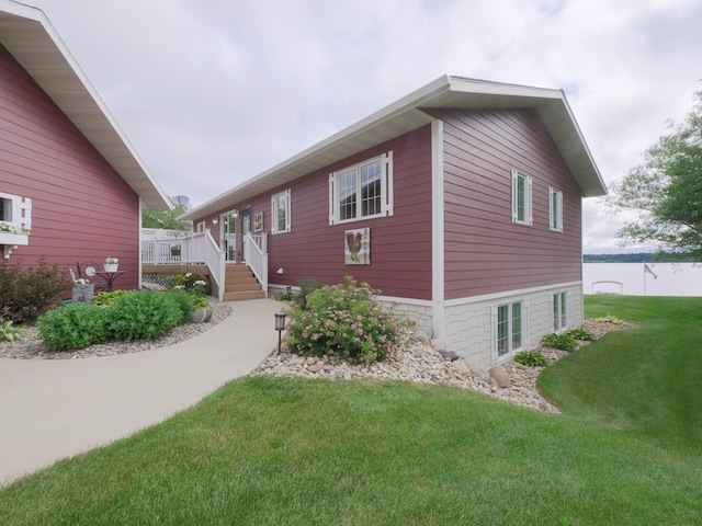 27842 Prairie Rose Rd, Elbow Lake, MN 56531 - view of side of property with a deck and a lawn