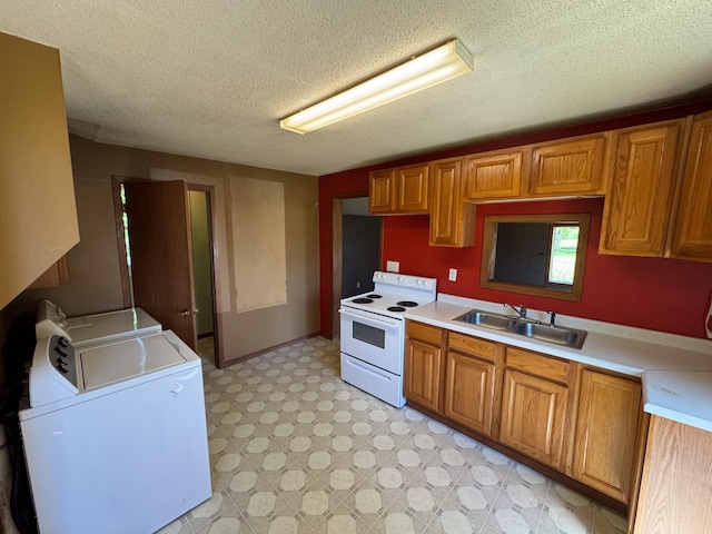17864 County Road 66 NE, Eagle Bend, MN 56446 - kitchen with electric stove, washer and dryer, a textured ceiling, light countertops, and brown cabinets