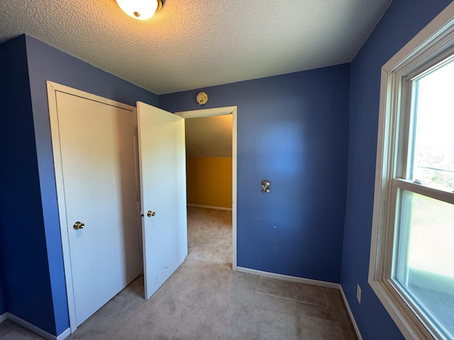 17864 County Road 66 NE, Eagle Bend, MN 56446 - unfurnished bedroom featuring carpet, a closet, and a textured ceiling