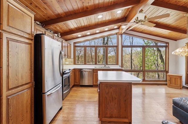 11 Eagle Ridge Rd, North Oaks, MN 55127 - kitchen with stainless steel appliances, light countertops, a center island, wooden ceiling, and light wood-style floors