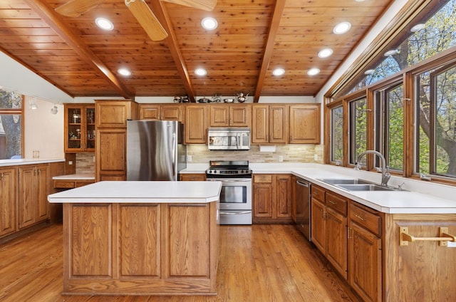 11 Eagle Ridge Rd, North Oaks, MN 55127 - kitchen featuring stainless steel appliances, wood ceiling, light wood-style floors, a center island, and tasteful backsplash