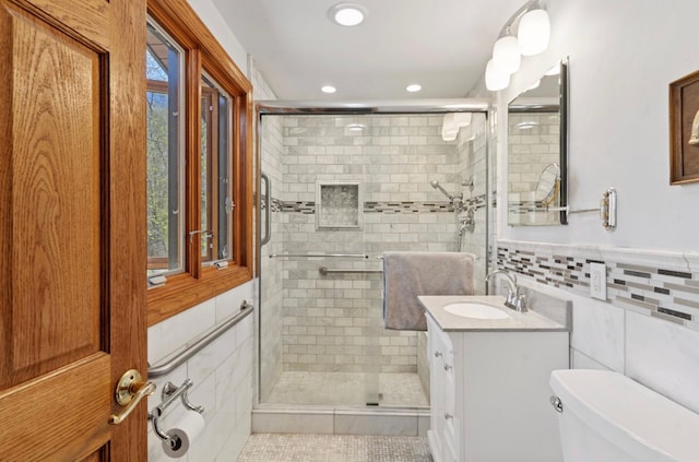 11 Eagle Ridge Rd, North Oaks, MN 55127 - bathroom featuring tile walls, vanity, a stall shower, and recessed lighting