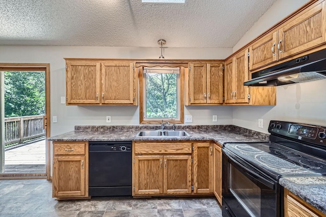 703 11th Ave SW, Isanti, MN 55040 - kitchen with black appliances, under cabinet range hood, dark countertops, a textured ceiling, and brown cabinetry