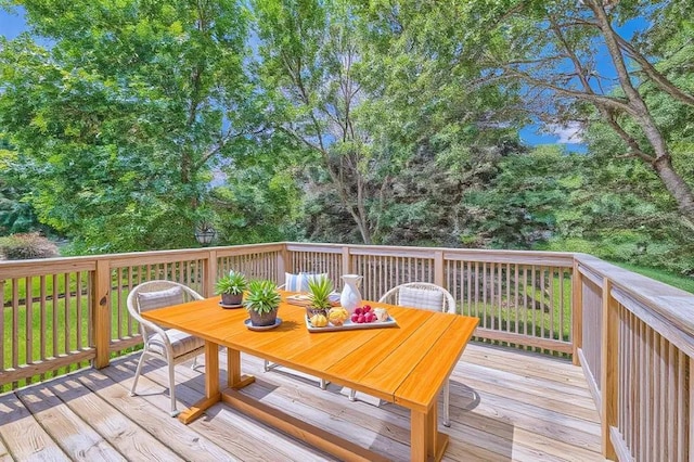 703 11th Ave SW, Isanti, MN 55040 - wooden terrace featuring outdoor dining space
