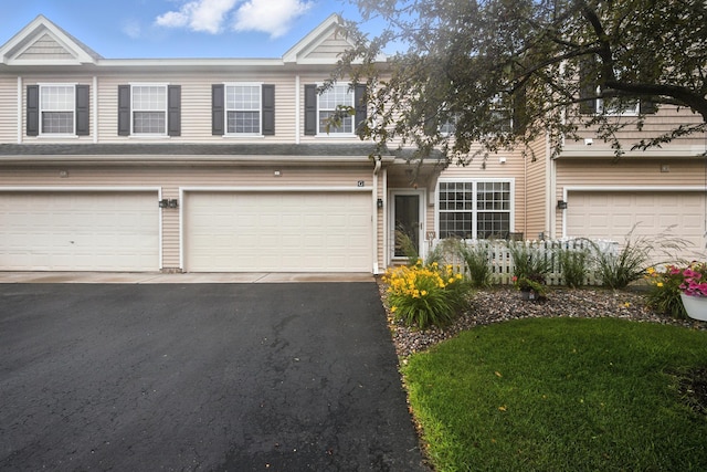 12240 Urbank St NE Unit G, Blaine, MN 55449 - view of property featuring asphalt driveway and a garage