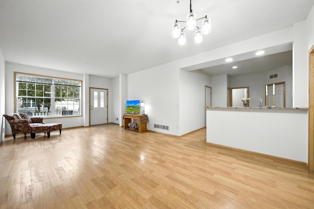 12240 Urbank St NE Unit G, Blaine, MN 55449 - living room featuring light wood-type flooring, a chandelier, and recessed lighting