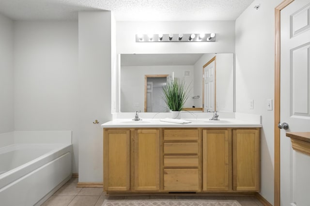 12240 Urbank St NE Unit G, Blaine, MN 55449 - bathroom with double vanity, tile patterned flooring, and a bath