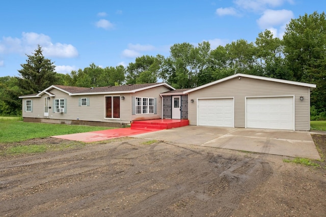 5070 10th St NW, Maple Lake, MN 55358 - view of front of house with driveway, a garage, and roof with shingles