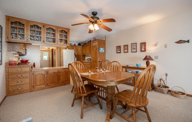 3925 Plainview Dr NW, Hackensack, MN 56452 - dining space with light carpet, ceiling fan, and a textured ceiling