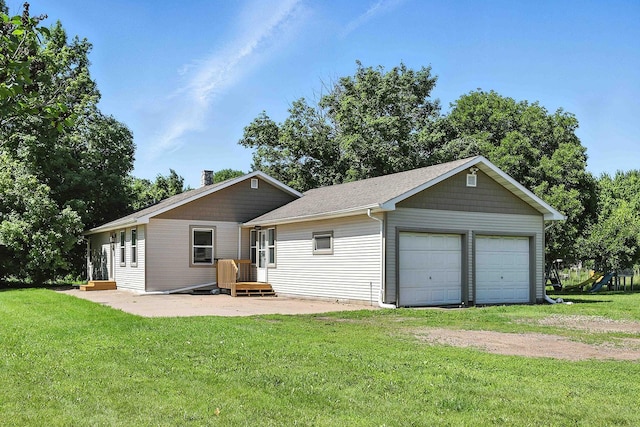 2314 347th Ave NE, Cambridge Twp, MN 55008 - back of house featuring a garage, a yard, and a chimney