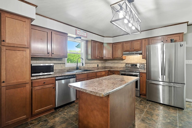 2314 347th Ave NE, Cambridge Twp, MN 55008 - kitchen featuring stainless steel appliances, under cabinet range hood, stone finish flooring, and decorative backsplash