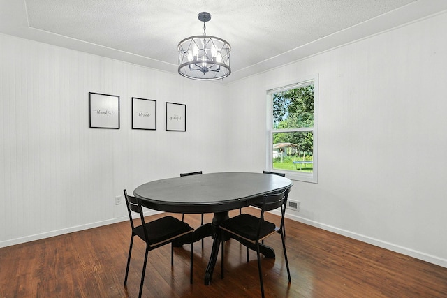 2314 347th Ave NE, Cambridge Twp, MN 55008 - dining space featuring a chandelier, dark wood-style floors, and a textured ceiling