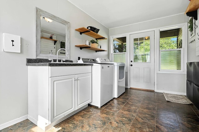 2314 347th Ave NE, Cambridge Twp, MN 55008 - washroom featuring stone finish floors, independent washer and dryer, and cabinet space