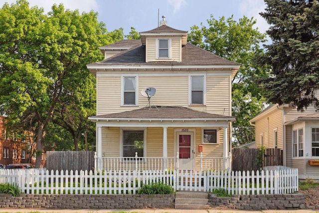 1535 Sherburne Ave, Saint Paul, MN 55104 - american foursquare style home with a porch, a fenced front yard, and roof with shingles