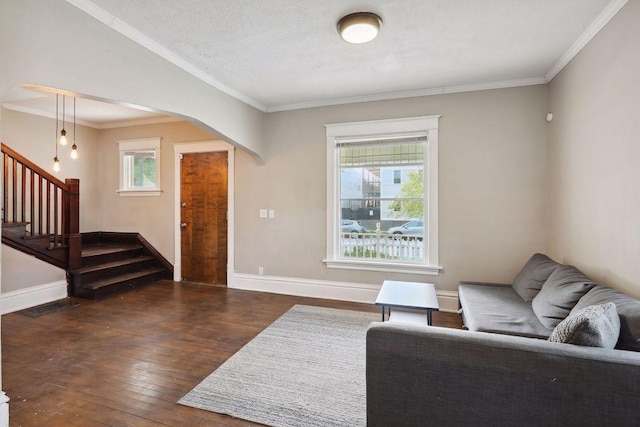 1535 Sherburne Ave, Saint Paul, MN 55104 - living area featuring stairs, hardwood / wood-style floors, crown molding, and arched walkways