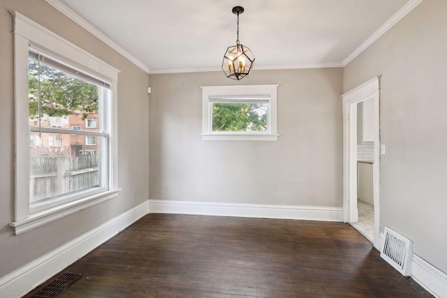 1535 Sherburne Ave, Saint Paul, MN 55104 - unfurnished dining area featuring plenty of natural light, dark wood-type flooring, a chandelier, and crown molding