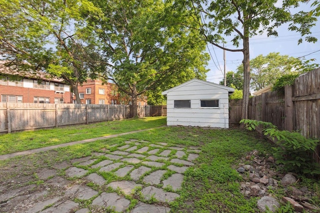 1535 Sherburne Ave, Saint Paul, MN 55104 - fenced backyard featuring an outdoor structure and a patio