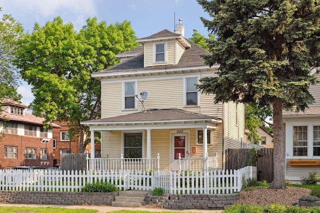 1535 Sherburne Ave, Saint Paul, MN 55104 - view of front of property with a porch, a chimney, and a fenced front yard