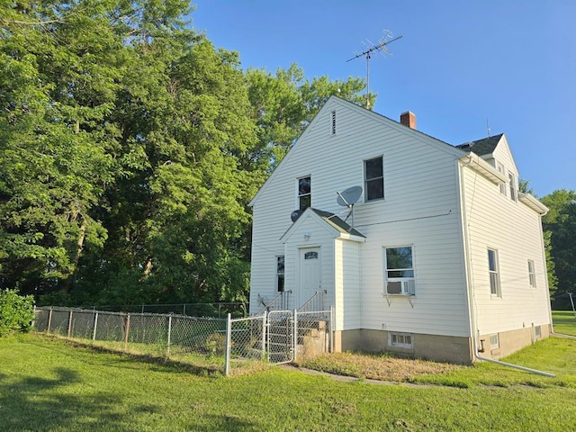 36789 State Highway 22, New Sweden Twp, MN 56082 - rear view of property featuring a chimney and cooling unit