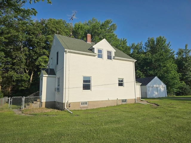 36789 State Highway 22, New Sweden Twp, MN 56082 - view of property exterior with a chimney, a gate, a garage, and cooling unit