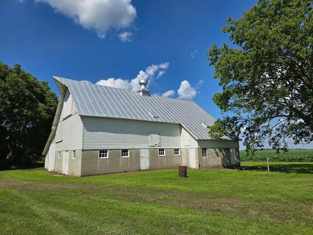 36789 State Highway 22, New Sweden Twp, MN 56082 - rear view of house featuring a yard, a metal roof, an outdoor structure, and a barn
