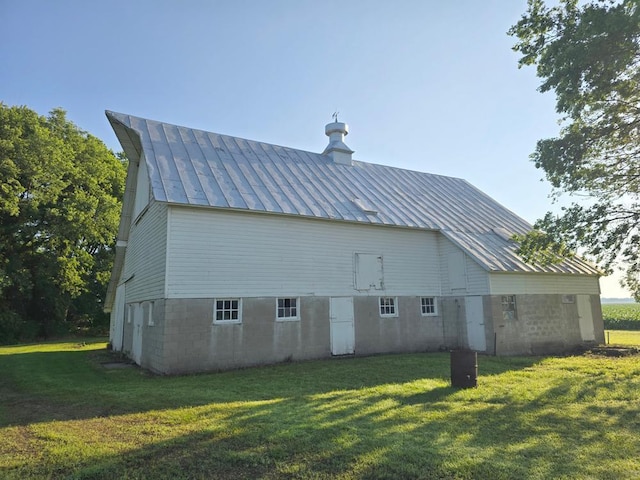 36789 State Highway 22, New Sweden Twp, MN 56082 - view of side of property with a standing seam roof, a metal roof, and a yard