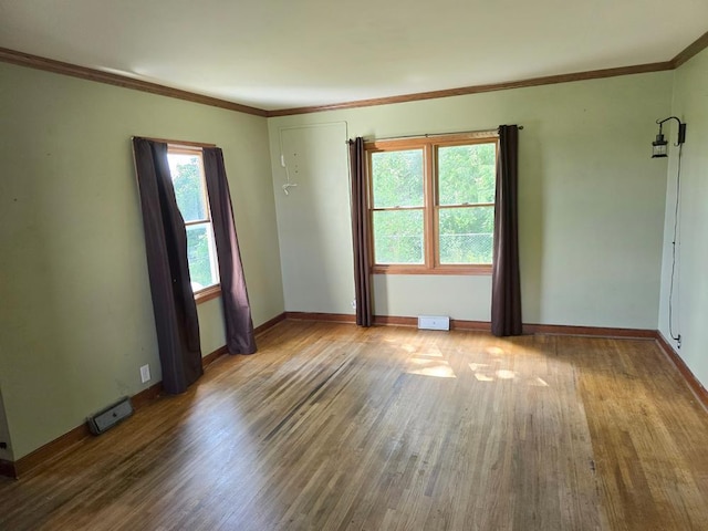 36789 State Highway 22, New Sweden Twp, MN 56082 - unfurnished room with wood finished floors and ornamental molding