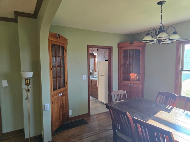 36789 State Highway 22, New Sweden Twp, MN 56082 - dining area featuring wood finished floors and a chandelier