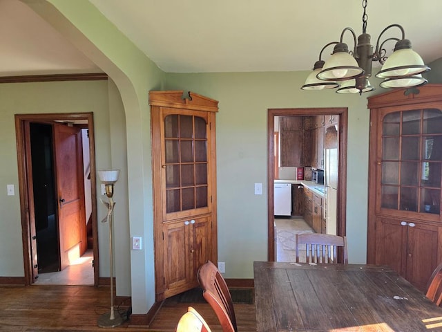 36789 State Highway 22, New Sweden Twp, MN 56082 - dining area with a chandelier and dark wood finished floors