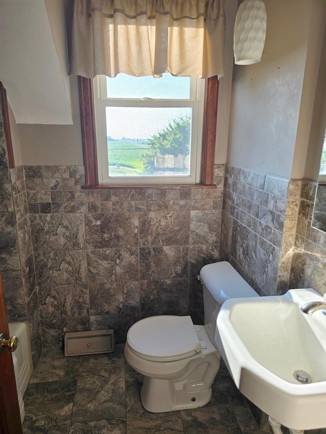 36789 State Highway 22, New Sweden Twp, MN 56082 - bathroom with tile walls and a wainscoted wall