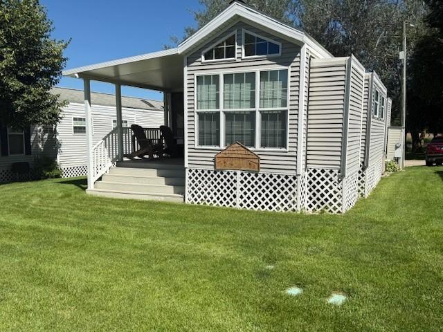 5055 Lake Mary Dr SW Unit 18, Alexandria, MN 56308 - back of property with a lawn