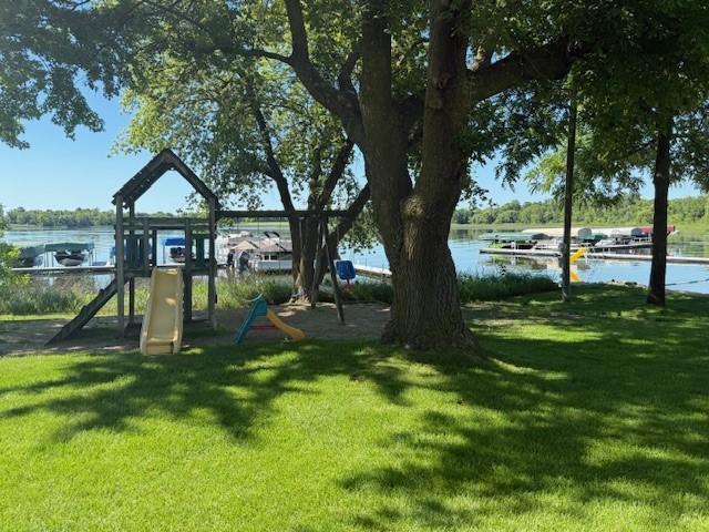 5055 Lake Mary Dr SW Unit 18, Alexandria, MN 56308 - view of green lawn featuring a water view